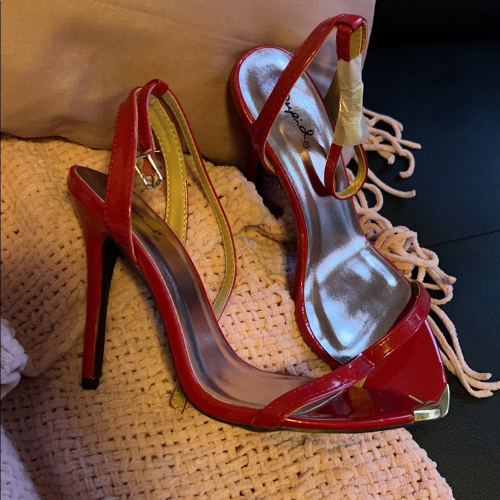 Nwt red heels with gold toe plate and buckle